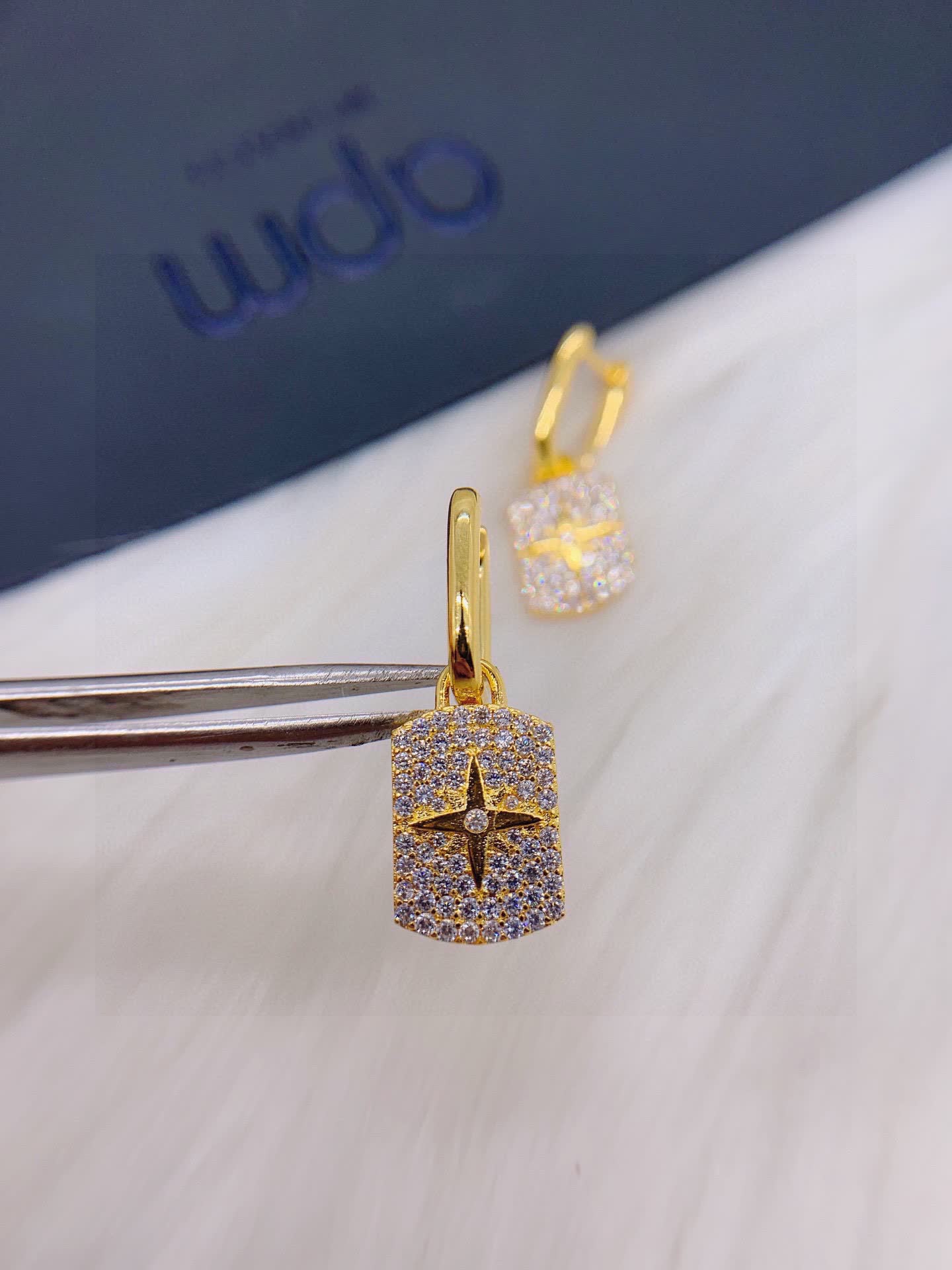 APM Monaco Elegant Gold and Diamond Star Earrings